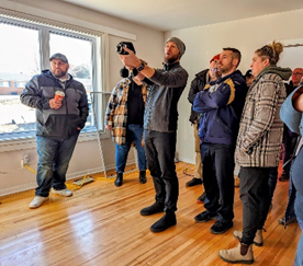 A group of individuals during a demonstration of the infrared imaging