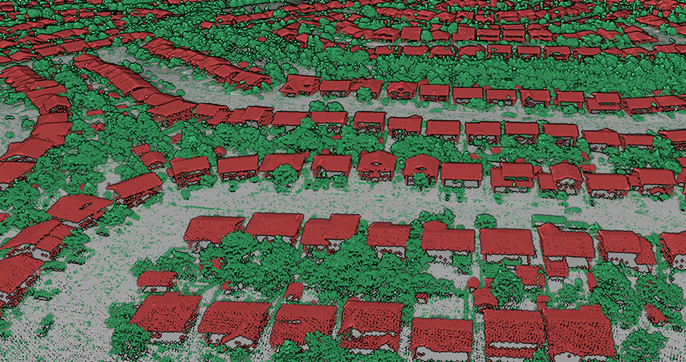 A 3D view of point clouds from above of a neighbourhood of houses and trees. Points corresponding to buildings, trees and the ground were colorized as red, green and gray, respectively.