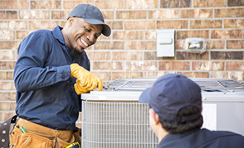 Contractor repairs air conditioner