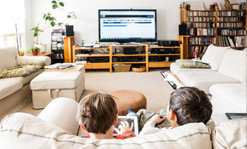  Two brothers watching TV