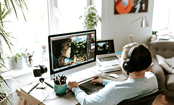 Man works in sun-lit home office