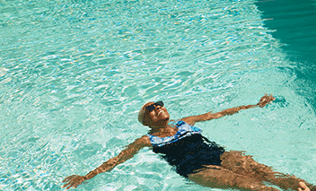 Woman swims in pool