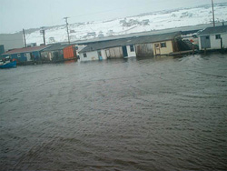 FIGURE 23: Flooding in St. Lawrence, NL., due to storm surge from Placentia Bay, February 2004, triggered by southwesterly wind (from Southern Gazette, Marystown, NL).