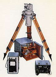 
Gyro-theodolite setup with instrument on a tripod and consoles on the ground
