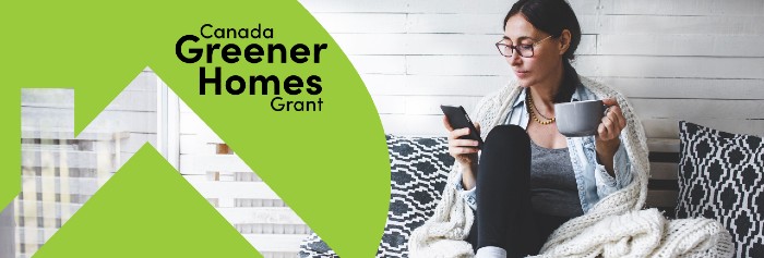 Canada Greener Homes Grant main banner with logo and woman looking at her smartphone.