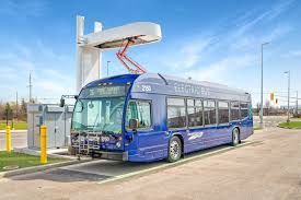 Electric bus underneath charging canopy