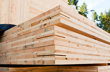 A stack of cross-laminated timber panels.