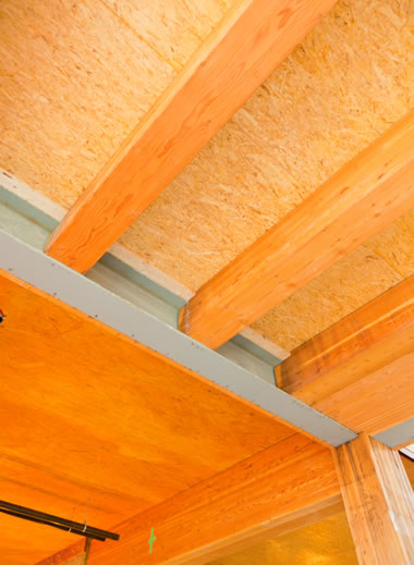 The underside of a floor showing panels constructed out of laminated strand lumber.