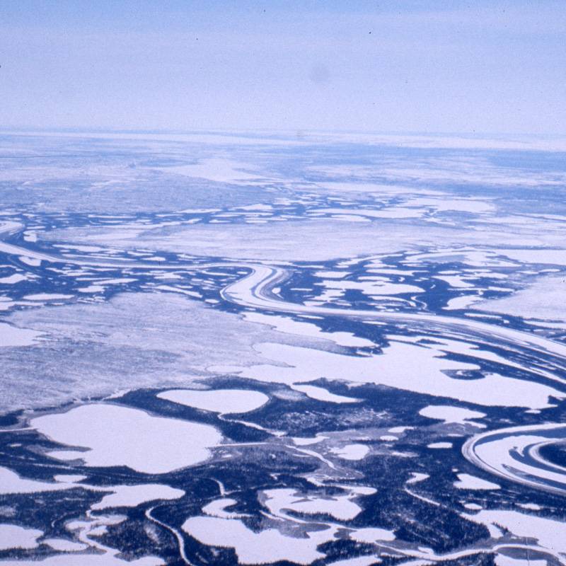 Aerial photo of the frozen Dehcho (Mackenzie River), Northwest Territories