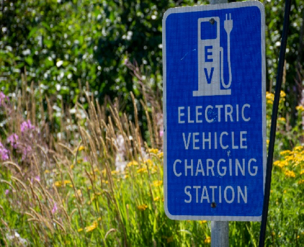 Sign identifying access to electric vehicle charging station