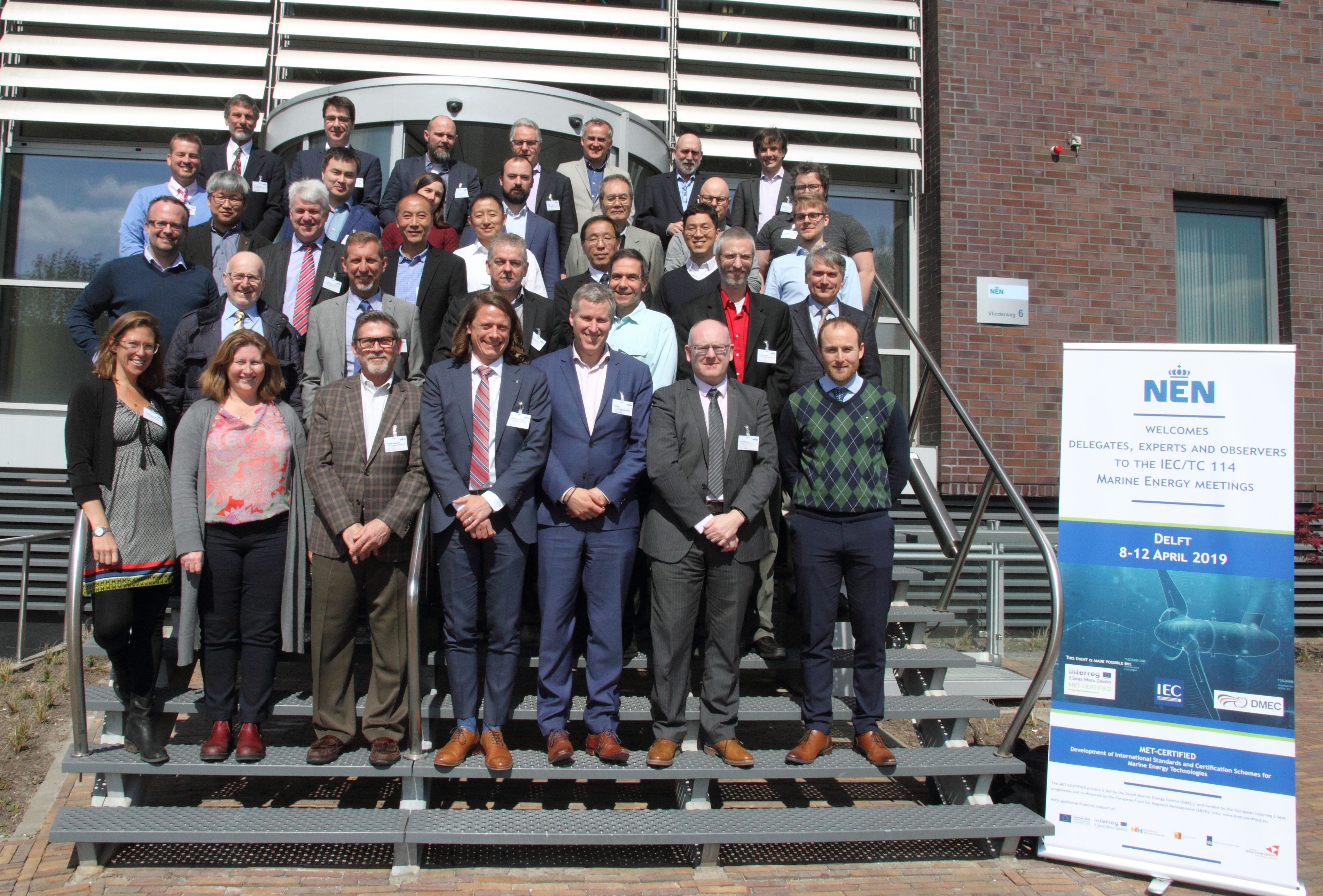 A group photo of many of the SMC TC114 members & other country members that were at a plenary