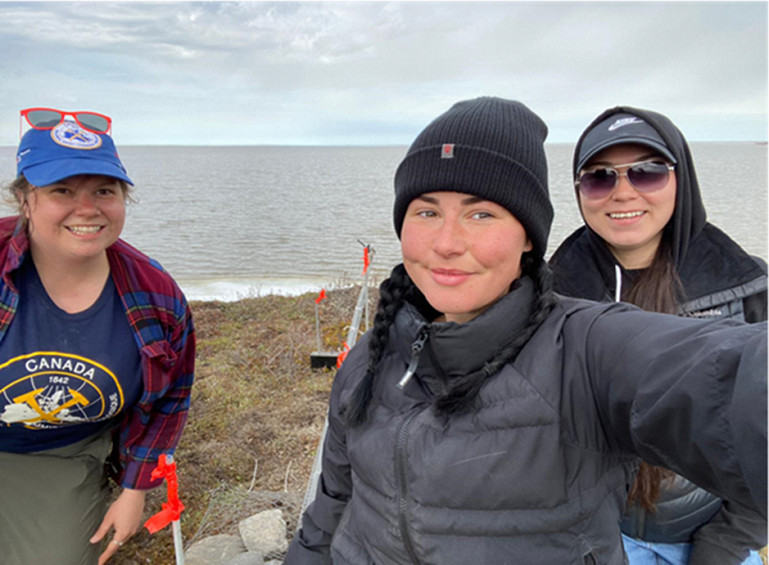 Picture of PhD student Eleanor Wratten (Northumbria University, U.K.), GSC post-doctorate fellow Rebecca Lee and Deva-Lynn share an inspired moment in the field