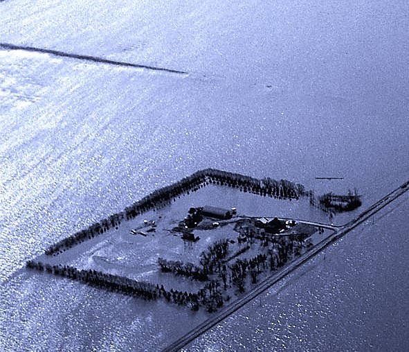 A Manitoba farmstead surrounded by Red River floodwaters in 1997.