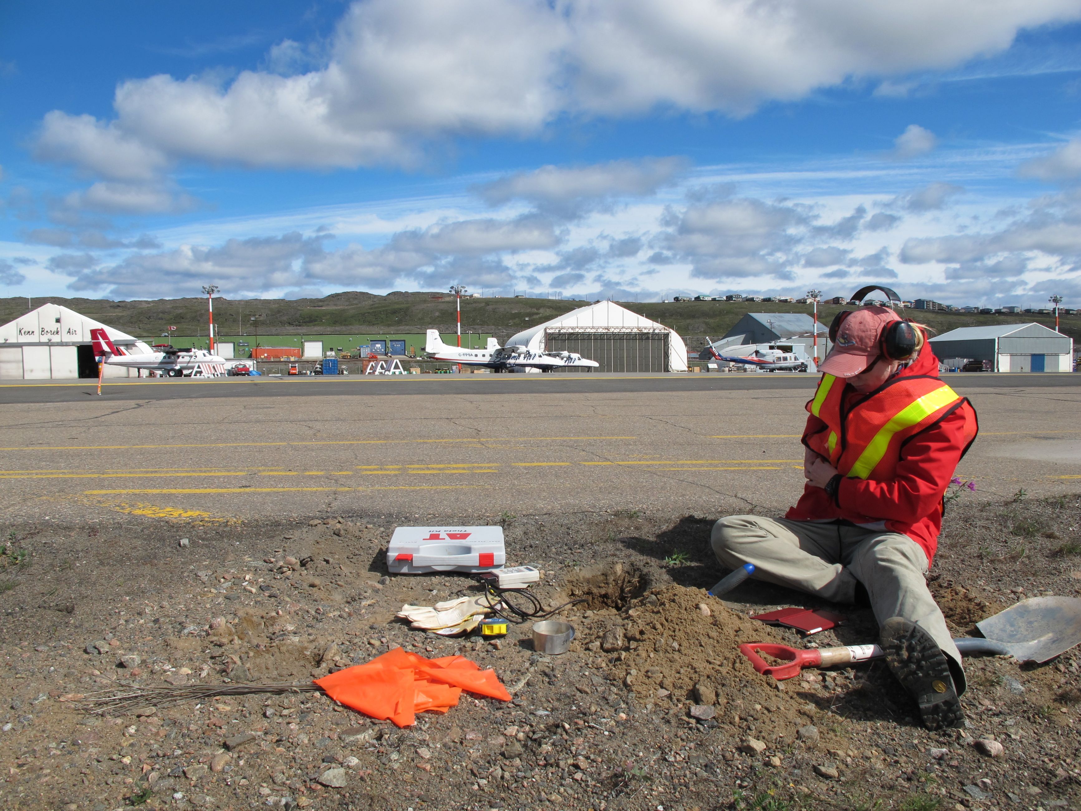 Image of a GSC scientist collecting permafrost monitoring data in Iqaluit, Nunavut
